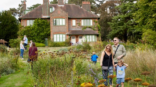 Visitors in the garden at Shaw's Corner, Hertfordshire